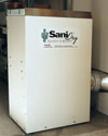 An installed crawl space dehumidifier with a self-draining design