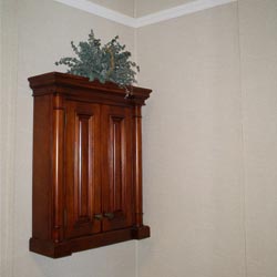 a cabinet mounted on a basement wall