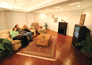 A family enjoying their finished basement living room