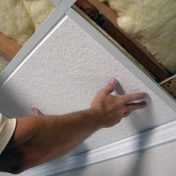 installing ceiling tiles in a finished basement