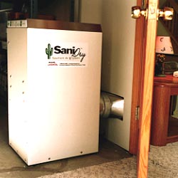 An energy efficient dehumidifier being ducted into a finished space