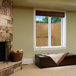 An egress window well and vinyl basement replacement window