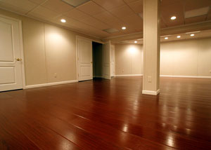 a finished basement with a wood laminate floor