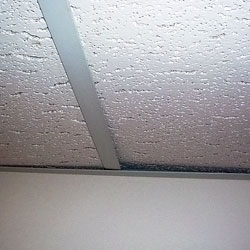A sagging basement ceiling tile system