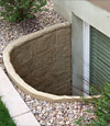 comparison of an old steel basement window well with a new vinyl basement window well