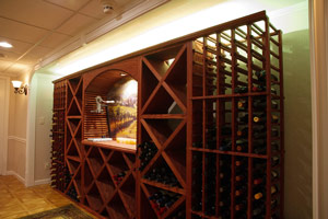 In addition to light-colored walls and ceilings, artwork can help make a basement feel open. This wine rack and counter frame a mural that feels a lot like an extra window!